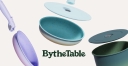 By the table logo