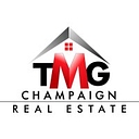 The Mcdonald Group Real Estate logo