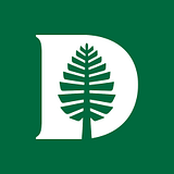 Dartmouth College - Tuck logo