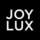 Joylux, Inc logo