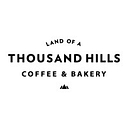 Land Of A Thousand Hills Coffee & Bakery   Cypress logo