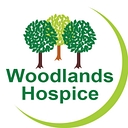 A Woodlands House logo
