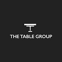 Logo de table group inc.