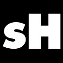 Sam Hill Entertainment logo