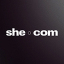 SHE logo