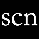 Spare Change News logo