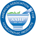 American Association of Homeopathic logo