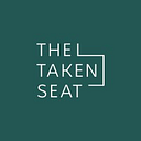 The Taken Seat logo