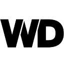 WOLD DRESS CO logo